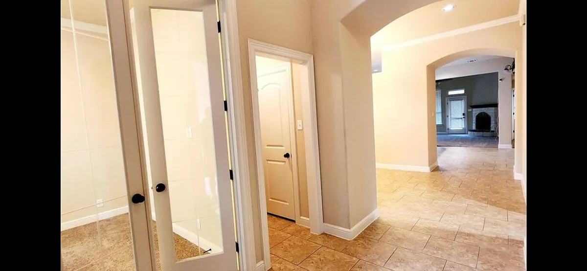 Entrance to the office and small hallway to half bath. - 12234 Chambers Cv