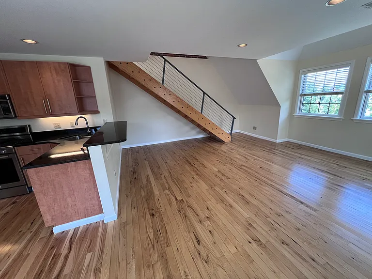 Kitchen and living room. Additional office nook under the stairs.