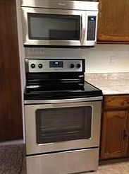 New stainless steel stove and over the range microwave.