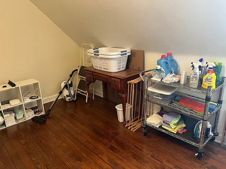 Laundry Room beyond machines: cart with cleaning supplies, Miele vacuum, clothes baskets, 2 drying racks