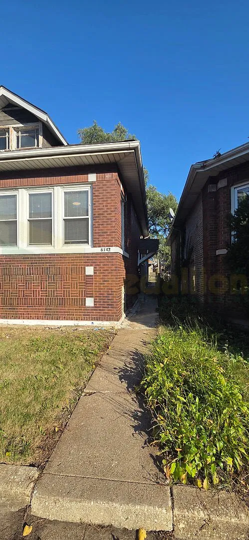 5-Bedroom, 2-Bath Brick Bungalow with Hardwood Floors and Finished Basement — Photo 3