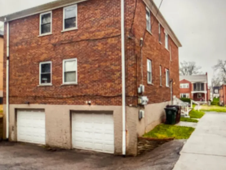 Rear of unit/garage spaces.