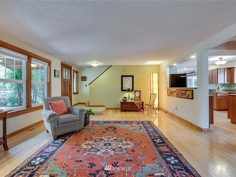 Living room looking towards garage. Stairs to second floor