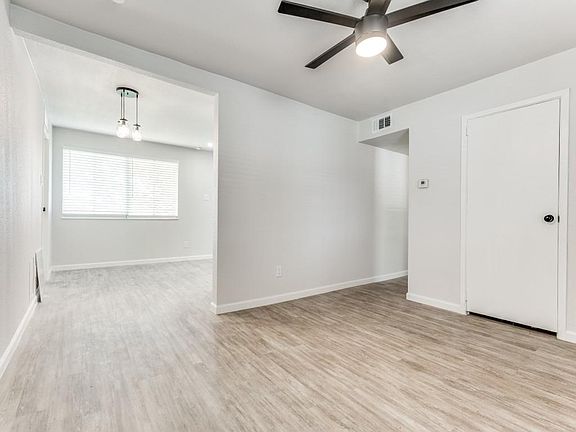 Unfurnished room featuring light wood finished floors and a ceiling fan