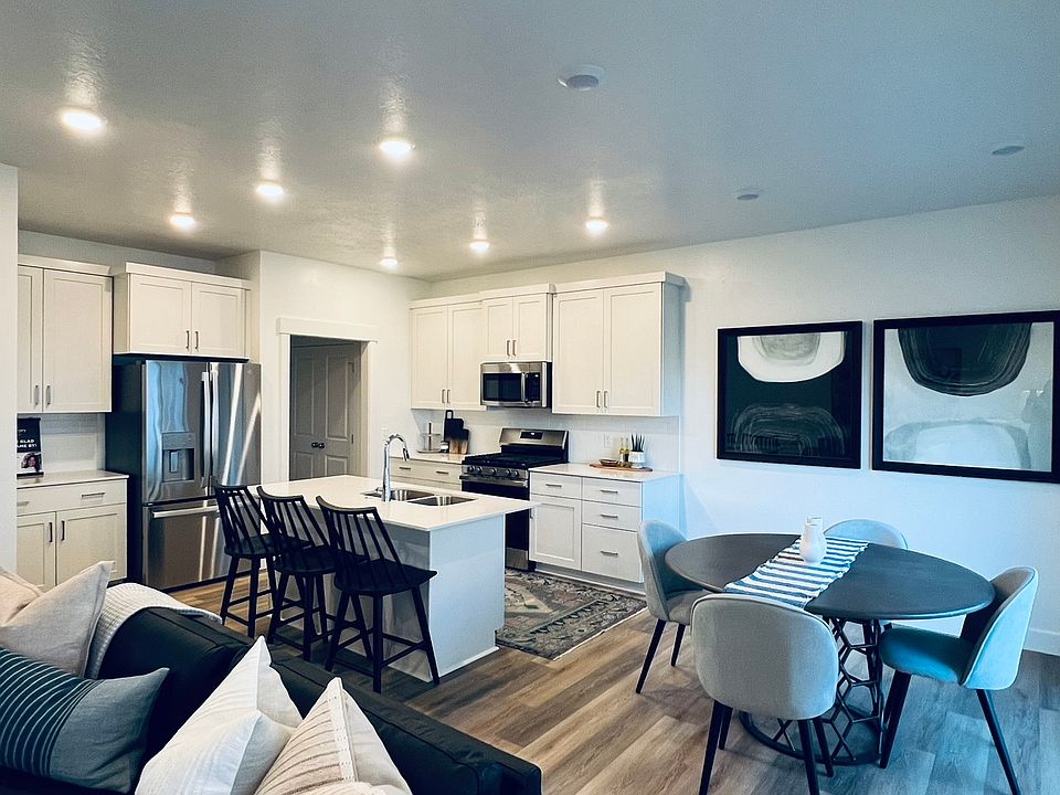 Open concept kitchen/dining and family room (photo of model home)