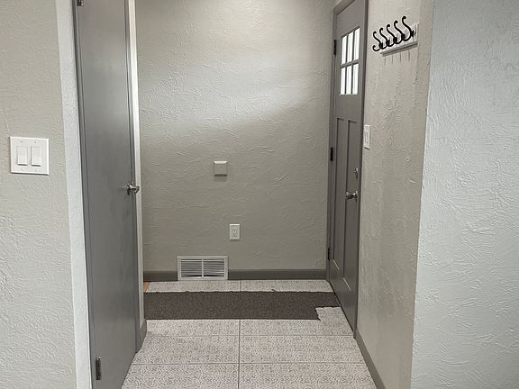 Main entrance with a family room to your left and straight down the hallway is the kitchen