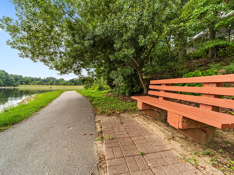 Lakeside bench and walking trail offer a relaxing outdoor escape close to home.
