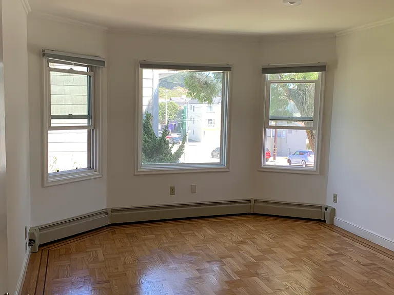 Living room with windows on both east and south side