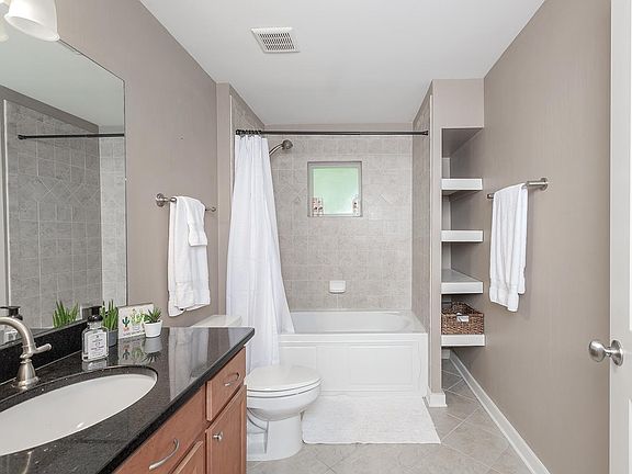built-in shelves, garden tub