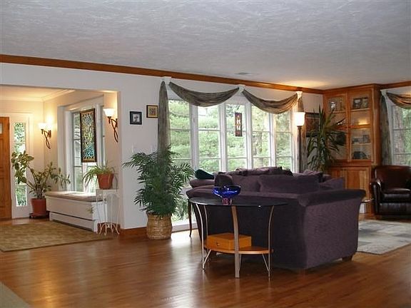 Formal living room with floor to ceiling windows