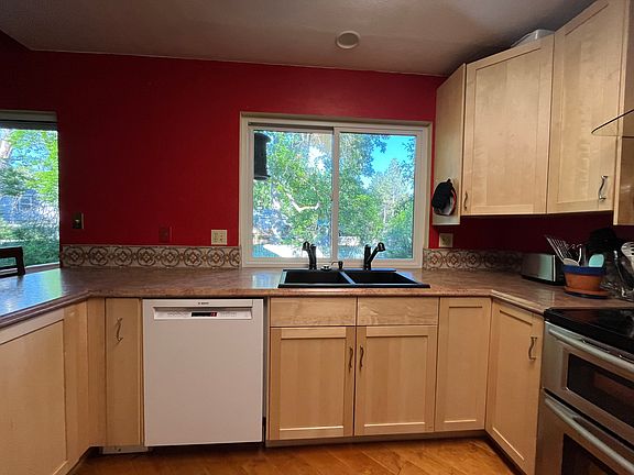 Kitchen looking east. 2 faucet sink w/garbage compactor. Bosch dishwasher. LG induction stove.