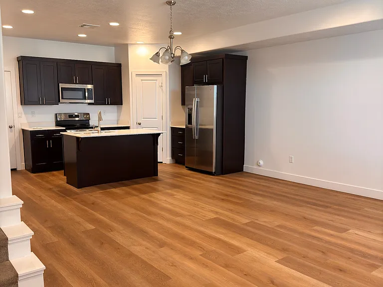 Kitchen has microwave, dishwasher, large pantry, and upgraded GE refrigerator.