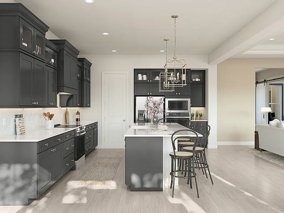 Kitchen with glass upper cabinets and pendant lighting