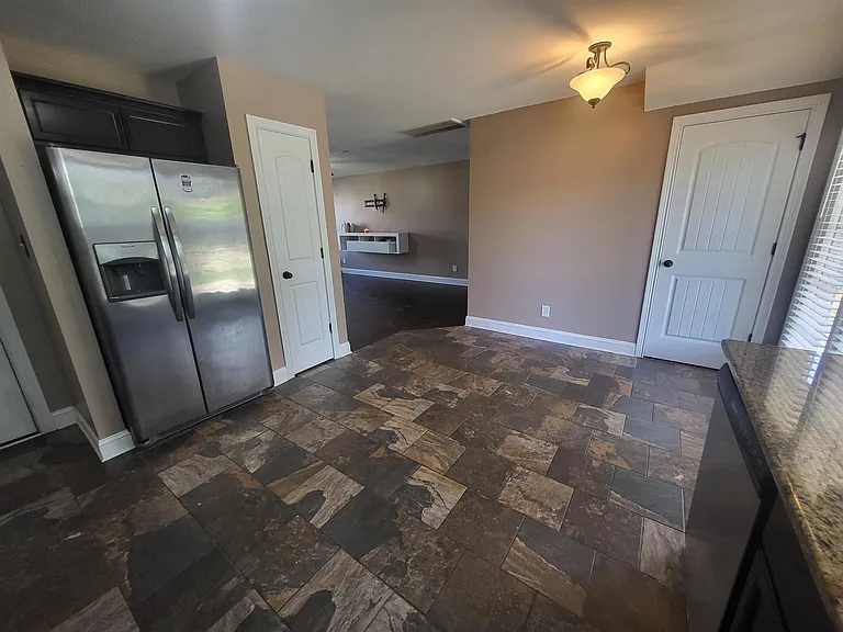 Granite countertops and stainless steel appliances.