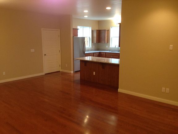 Entry door to alley-side attached garage and patio area
