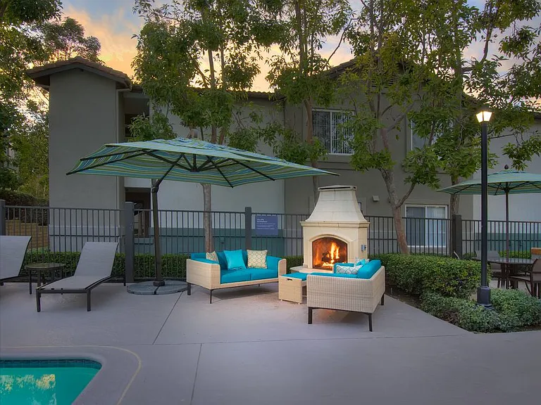 Swimming pool with lounge seating and fireplace