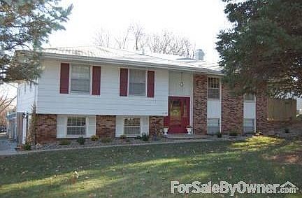 Front of House : Newly landscaped with bushes and flowers