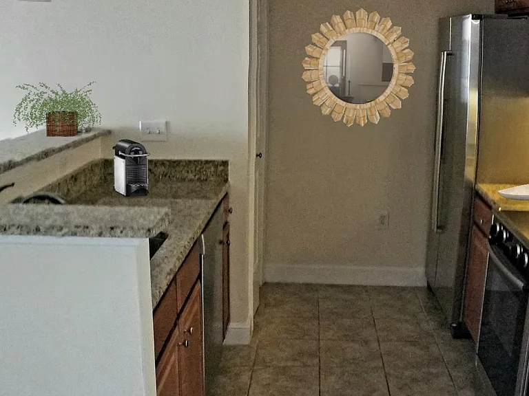 Stainless steel Bosch appliances and granite counters.
