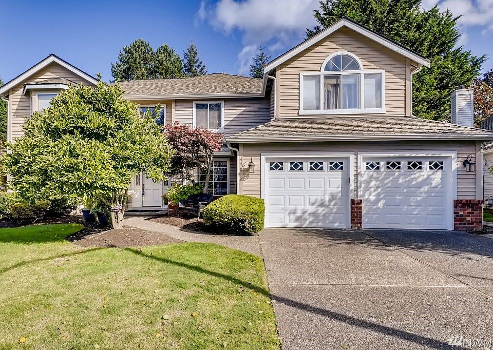 Beautiful well kept home inside and out. Nice landscaping and mature trees and plants.
