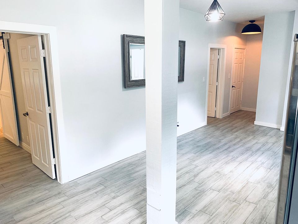 Living Room from Kitchen, facing front entrance hallway.