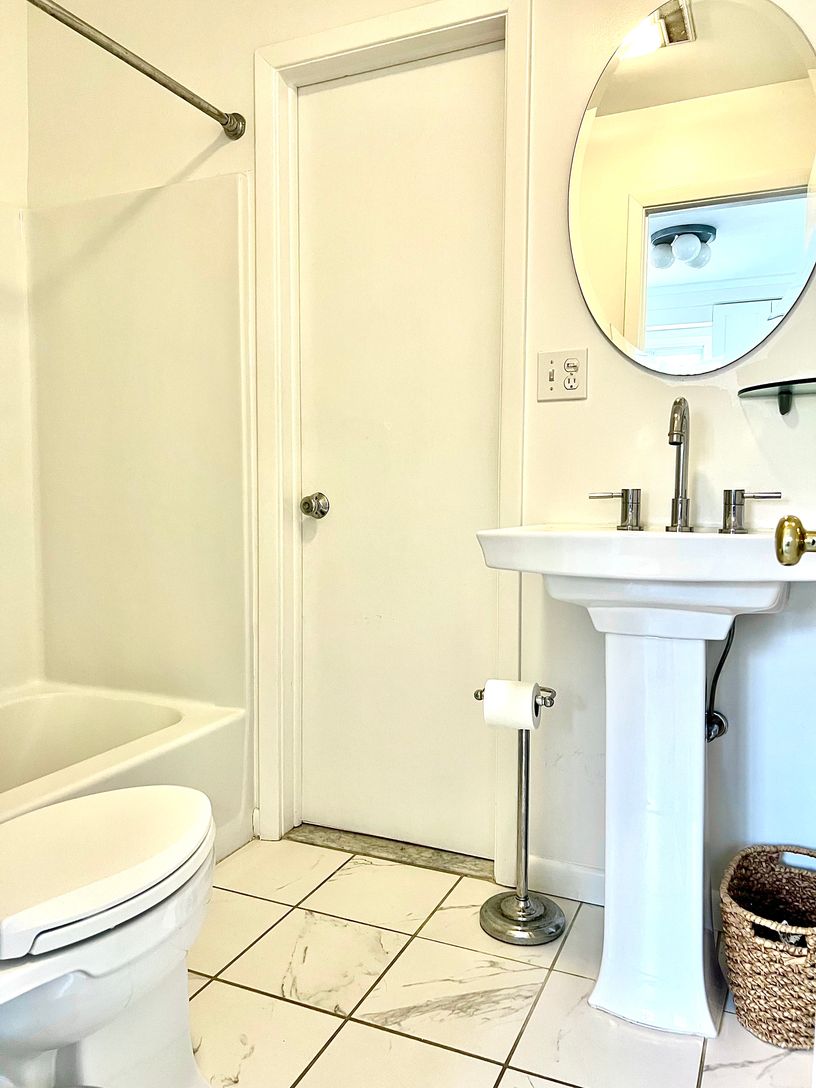  First floor full bathroom with custome tile and Kohler fixtures