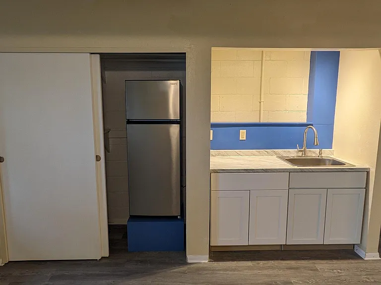 Completely remodeled kitchenette. Double-burner stove included. New refridgerator. Full closet to the left of the refrigerator.