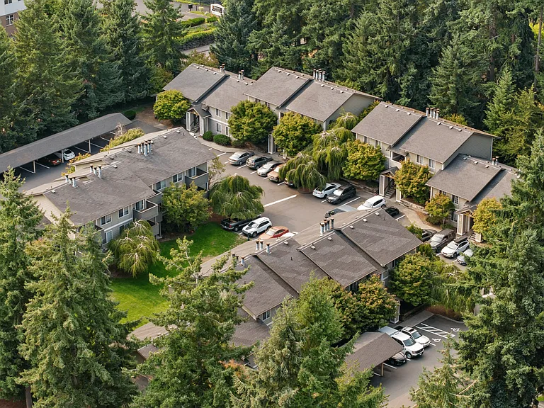 Peaceful apartment community tucked among the trees with ample parking and covered spaces.