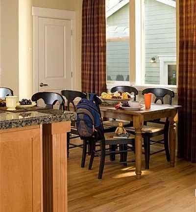 Kitchen eating nook with hardwood flooring. 