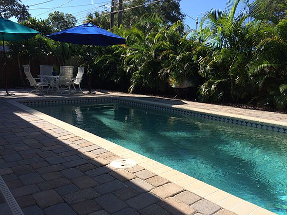 gorgeous salt pool, huge deck with pavers wraps around back