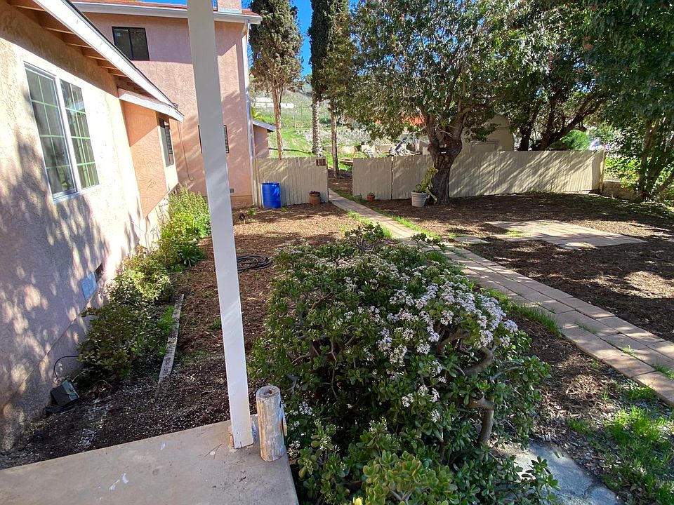 View from front porch. Yard in front of the white gate belongs to tenant. Tenant also has a private patio.