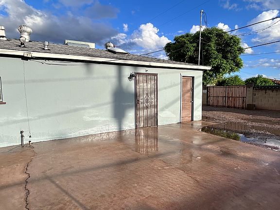 Driveway! The door on the left is the entrance to the living room area. The door to the right is a shed. You access the driveway by going through the alleyway between W Flower St and W Earll Dr on N 21st Ave.