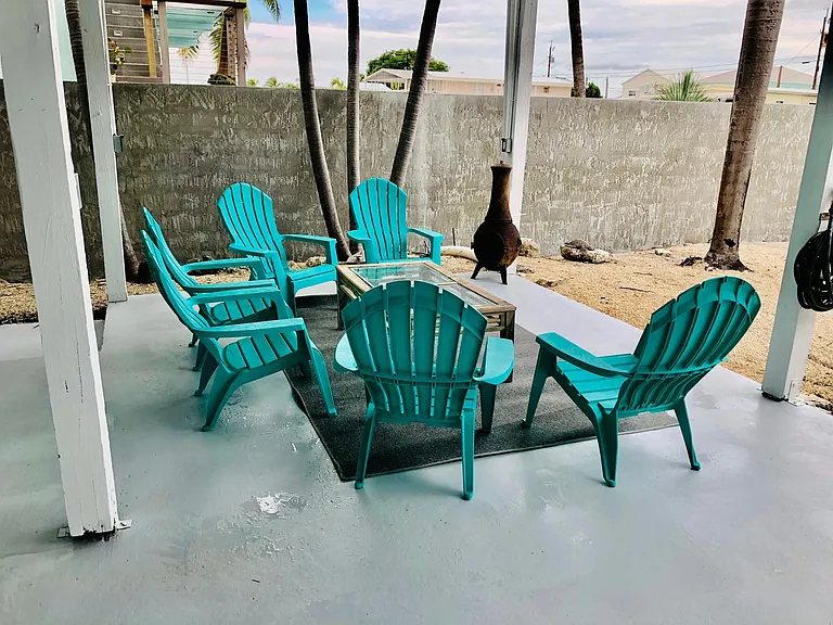 Ground level conversation seating with fire chimney