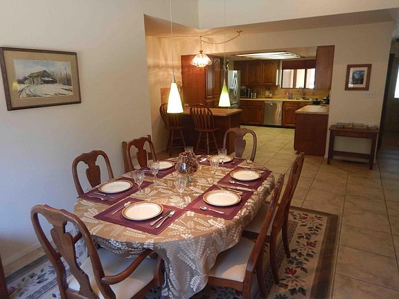 Dining room and kitchen areas. All plates and silverware are included in lease, as it a micro-wave, toaster, coffee-maker, electric range, and refrigerator.