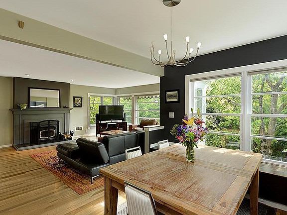 Spacious living spaces with working wood burning stove fireplace