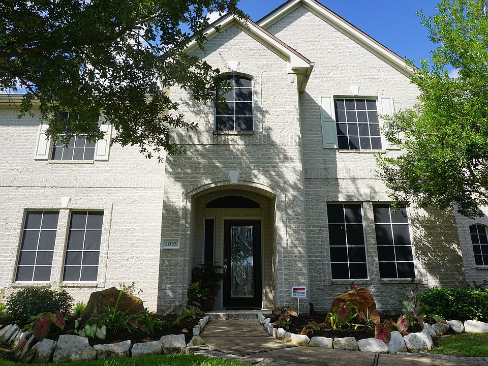 All white brick front entry