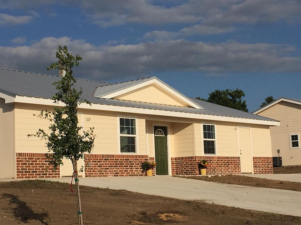 Photo of front of duplex before grass sod installed.