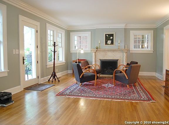 Huge (25 ft x 16 ft) living room with working fireplace.