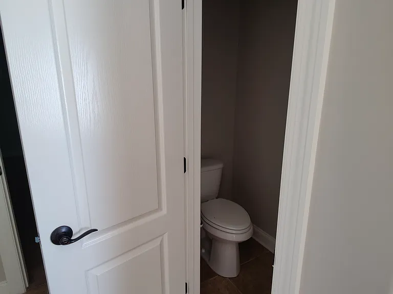 Master bathroom with separate toilet room.