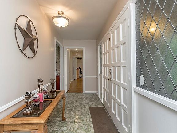 Upon entry the formal dinning room is to the left. To the right is the first of 4 bedrooms. The LARGE family room is straight ahead.