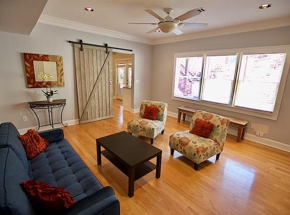 Sunlit living area with blinds for privacy.
