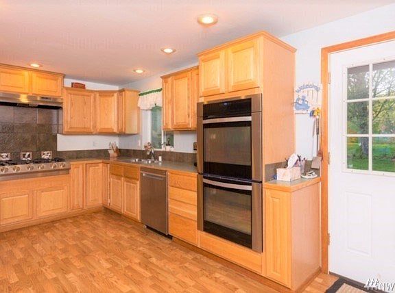 This is a cooks kitchen! 6 burner stove, double oven, and quiet dishwasher for easy clean up. All stainless steel.