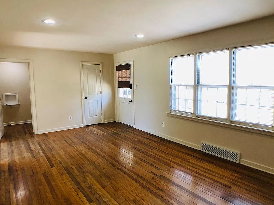 unfurnished front door entry and living room