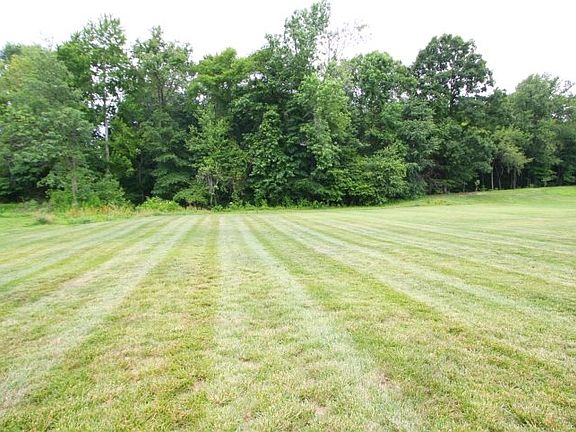 1.577 Acres with some woods.