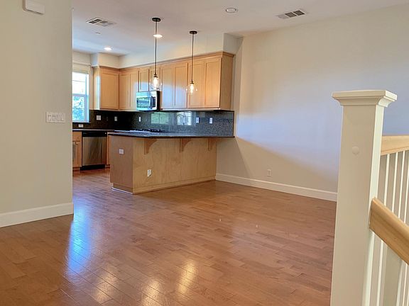 Kitchen with counter seating area; dining area to the right