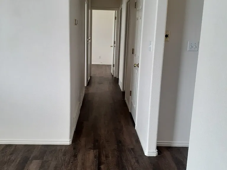 Hall to bathroom and 3 bedrooms