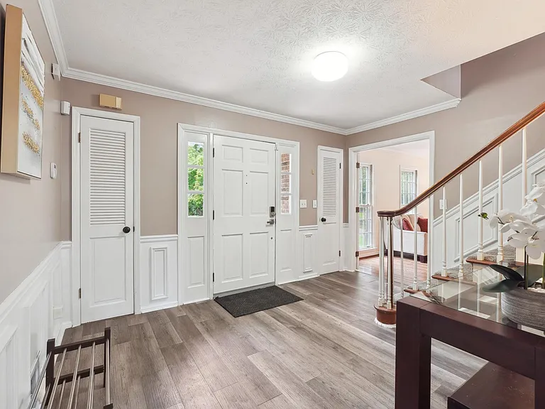 Main Entrance Foyer with staircase to Upstairs & door to Basement -Main Level