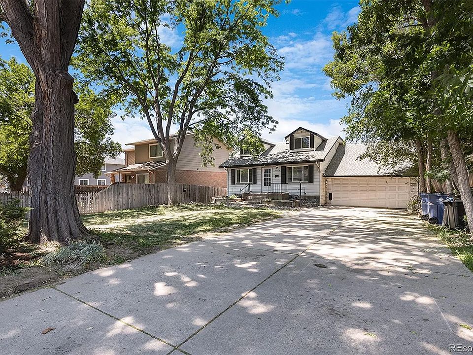 Large front yard and driveway for additional parking plus 2 car garage. Color of house is now a nice blue