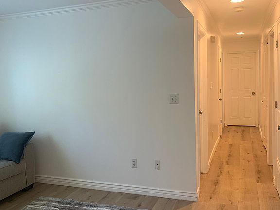 Hallway to 3 bedrooms and two bathrooms. Laundry closet is on the right, down the hall and there is a linen closet too.