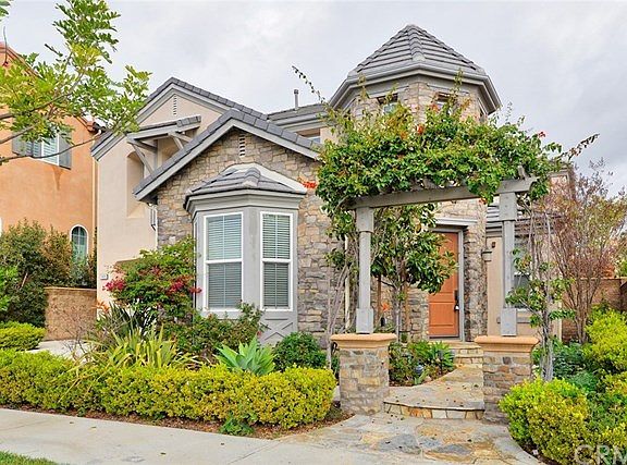Custom hardscape and landscape accent this lovely home.