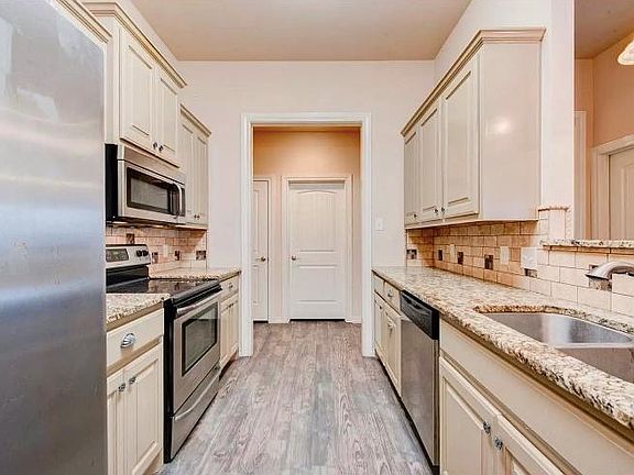 Kitchen from dining room to hall